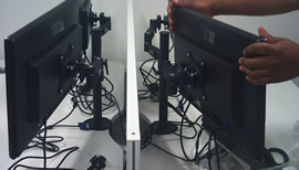 Engineers installing monitors during a system roll-out