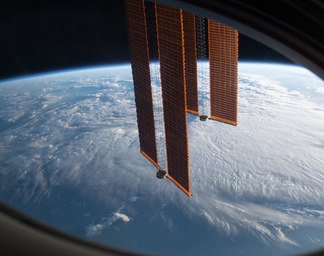 Satellite solar arrays above Earth